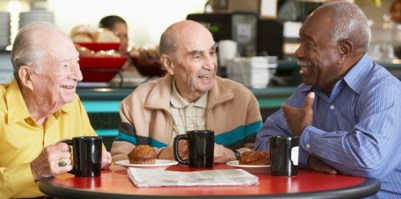 Senior men drinking tea together